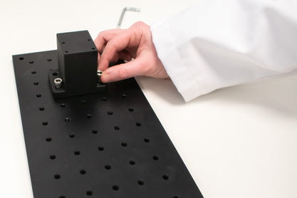 Position the Solar Simulator base to align with breadboard holes